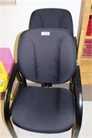 Pair of black office chairs