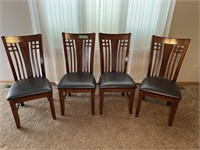 4 padded wooden chairs