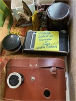 Vintage camera with lens and case, Excersize