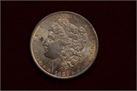 1886 Toned Morgan Silver Dollar BU