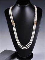 A Gold Metal, Pearl & Crystal Pendant Necklace