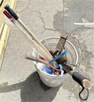 Bucket full of ice fishing poles scoops cleats