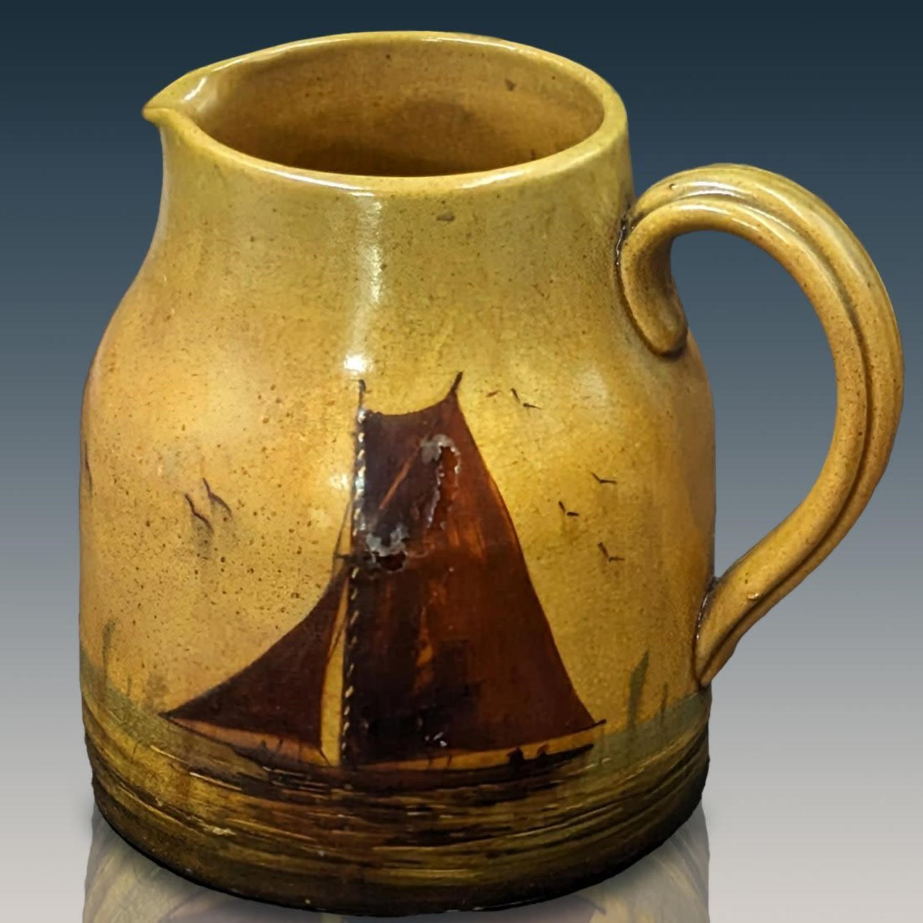 An Antique English Pottery Pitcher Painted With A