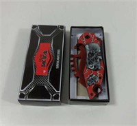 New in Box Stainless Steel Red Skulls Knife