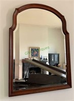 Large mahogany framed beveled wall mirror.