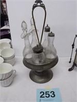 Silverplate caster stand with 2 cruets,