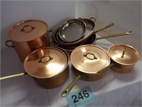 Copper pan set, unmarked, brass handles, nine