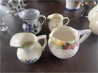 4 decorative pitchers