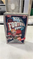 Lot of football cards factory sealed in box.