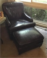 Leather? armchair with ottoman on casters