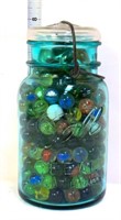 Blue fruit jar full of marbles