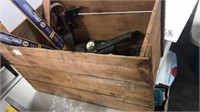 Wood box full of  hammers, tape measures, framing