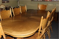 solid oak dining room table with matching 8 chairs
