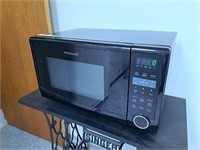 Frigidaire microwave. Powers on. 20" l x 13 1/2"