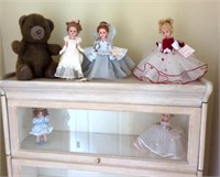 5 dolls and plush bear