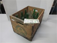 Vintage wooden box with vintage bottles