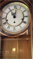 HOWARD MILLER WALL CLOCK  Oak stained wood with