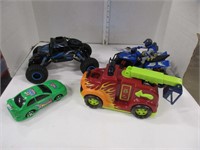 Four toy vehicles