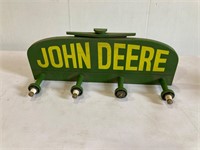 John Deere coat rack. Wooden. 18” wide