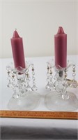 Two single candlestick holders.