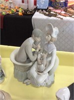 Lladro bisque couple with dog