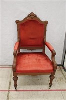 Antique Carved Upholstered Chair on Casters