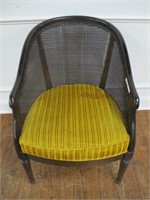 70'S BARRELL BACK CHAIR. CANE BACK AS IS SOLID