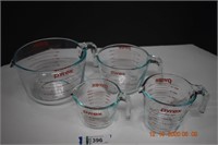 Four Pyrex Glass Measuring Cups