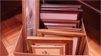 Box of framed art, mostly prints