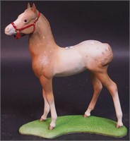 A Cybis foal figurine with bridle, 9" high