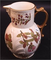 A Royal Worcester pitcher decorated with