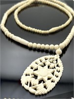 Carved bone floral necklace, 31" l.