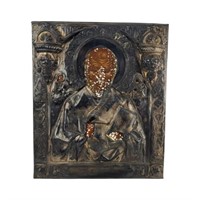 A Russian Painted Icon Of St. Nicholas With Silver