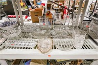 Shelf With Glass Pitchers Vases And Dishes