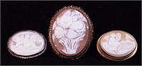 Three carved cameo brooches, two with