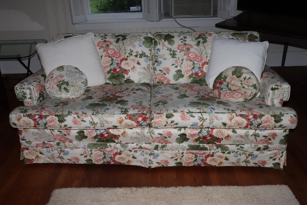 Floral upholstered 2 cushion sofa with pillows