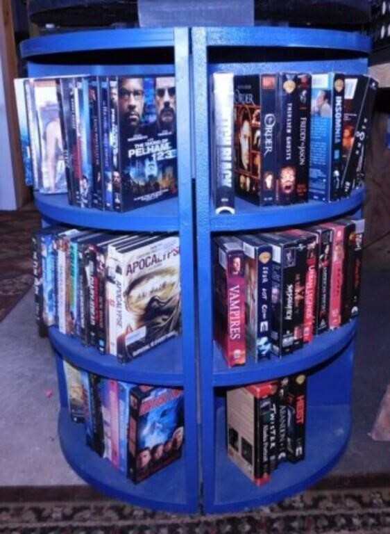 DVD movies & VHS tapes in half round bookcase