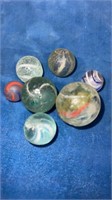 7 hand made marbles  damaged
