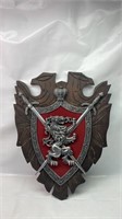 Wood and plastic crest shield