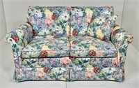 Flower fabric loveseat, down cushions, rolled arms