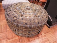 Large round ottoman with checkered quilt-style