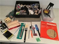 paint supplies, stapler, sand paper