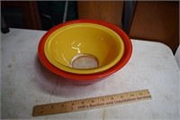 Two Red and Yellow Pyrex Bowls