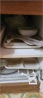 contents of cupboard- tupperware, santa pan and