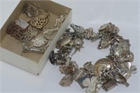 Silver charm bracelet with approx 50 charms