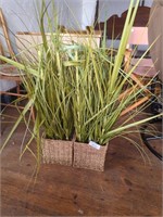 2 faux plants in Wicker baskets