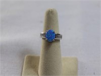 Oval cut blue opal ring