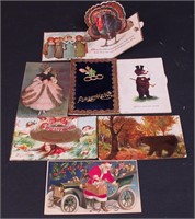 Seven unusual vintage postcards including