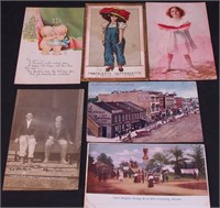 Six vintage postcards including kewpies