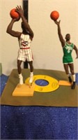Two 1997 NBA basketball figurines